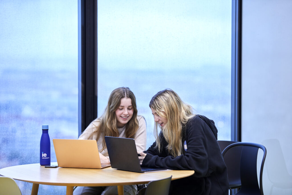 Two students working with their laptops