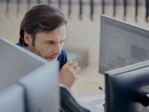 Man looking at a computer screen.