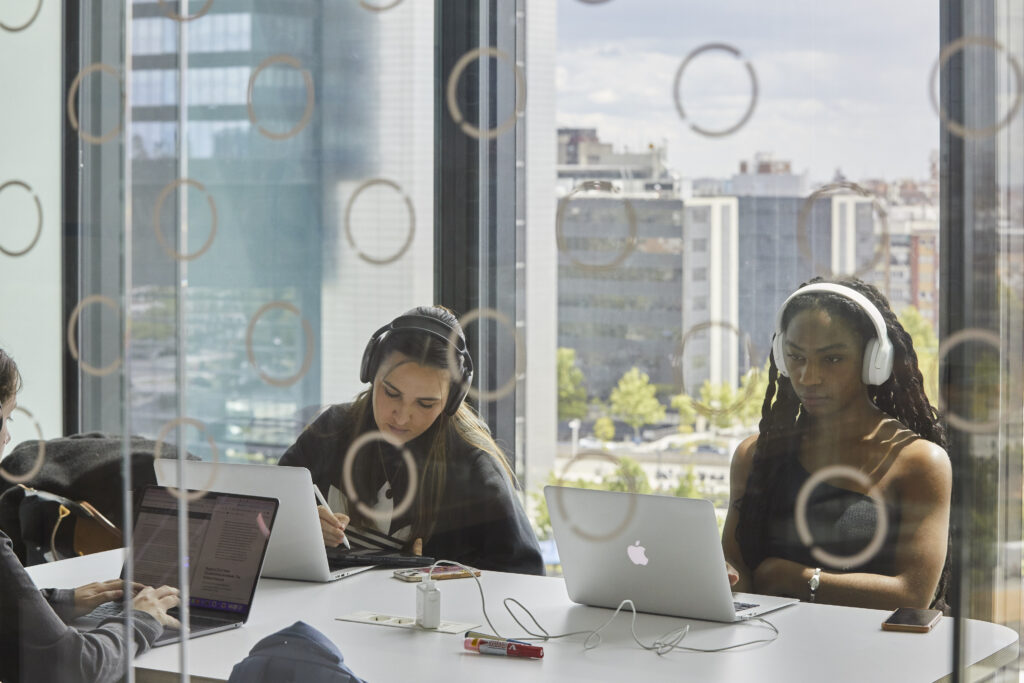 Two students working with their laptops