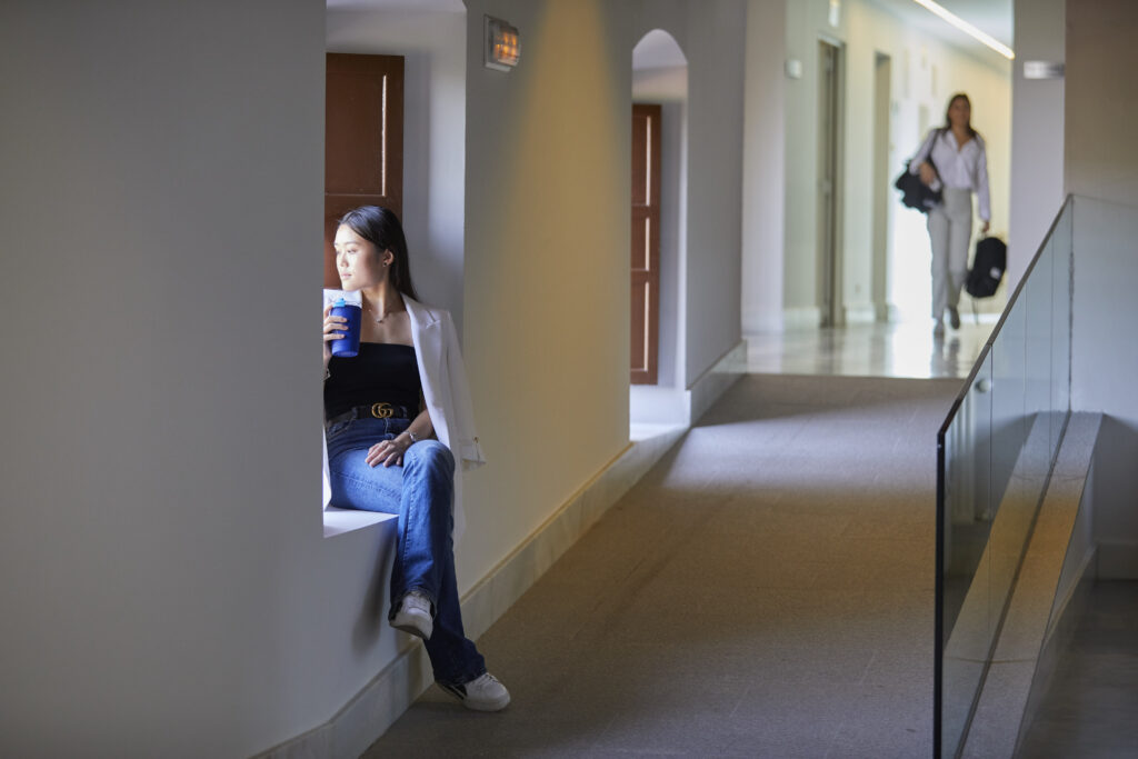 Student looking through a window