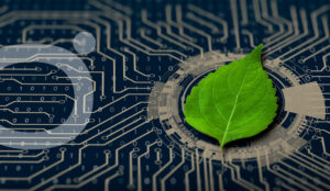 Imagen de sostenibilidad: placa base con hoja verde encima