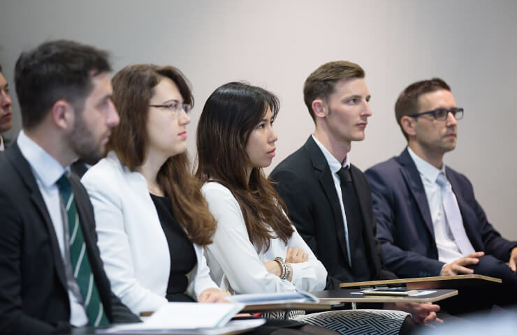 Attendants at the “Synergies in Finance & Artificial Intelligence” event listen to panelists discuss topics ranging from AI in financial services to the endless financial potential of blockchain technology.