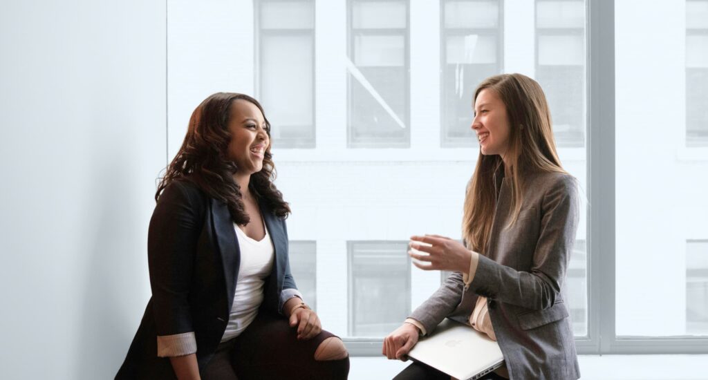 Two students sharing group project tips